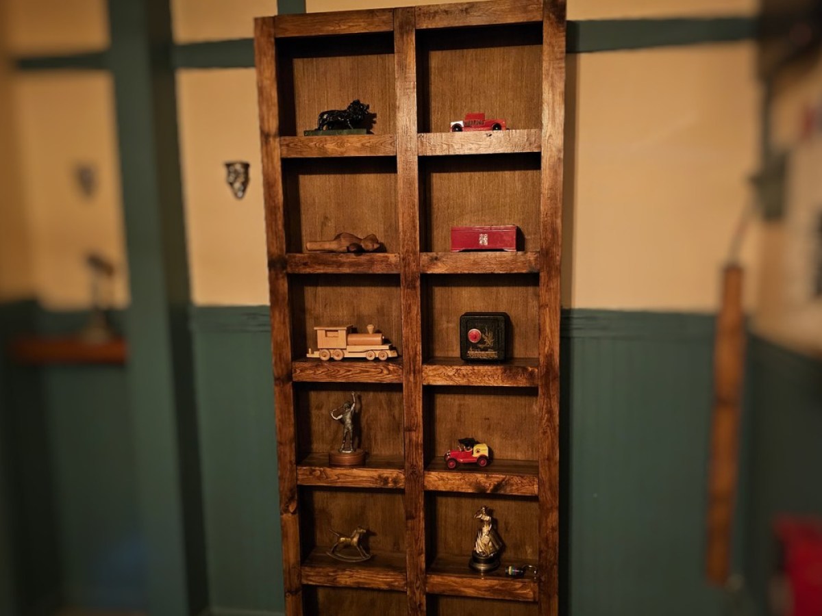 a room filled with furniture and a book shelf